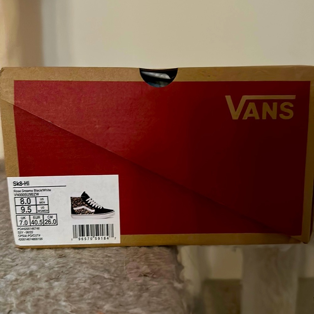 Vans high top shoe with flowers. Brand new in box. Sharing my love for shoes.